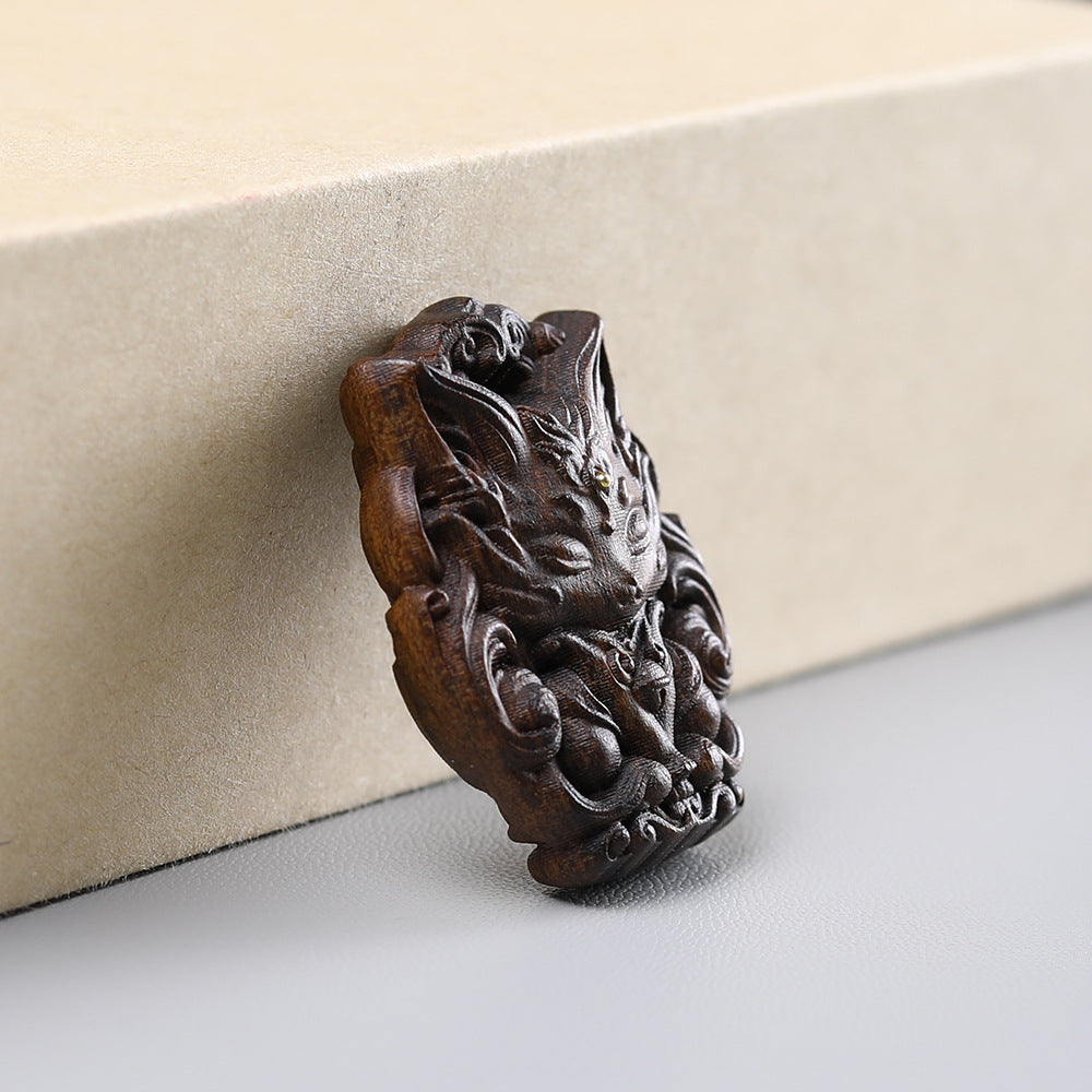 - Hand-Carved Agarwood Nine-Tailed Fox Pendant - Unique Mythical Jewelry Accessory
