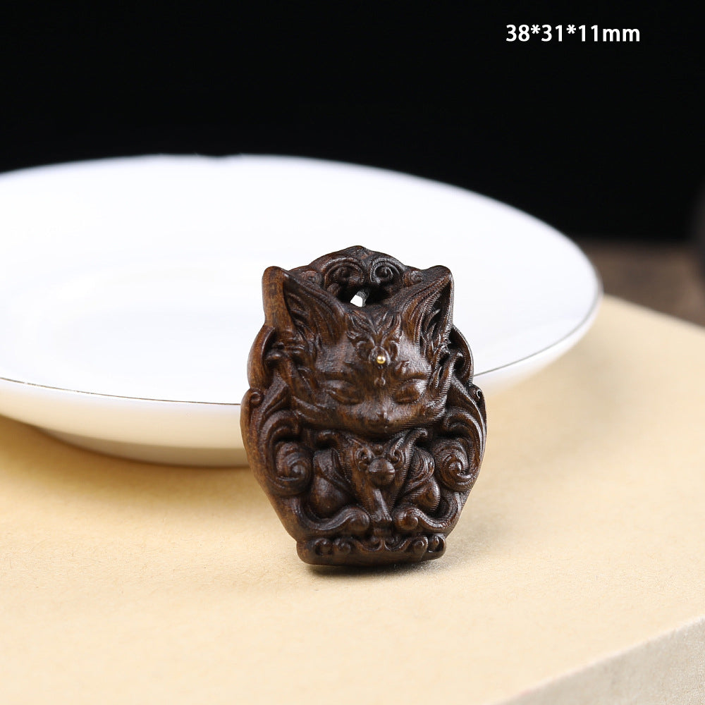 - Hand-Carved Agarwood Nine-Tailed Fox Pendant - Unique Mythical Jewelry Accessory